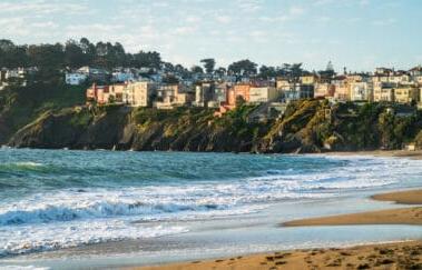 Luxury homes on cliffs extending out into San Francisco Bay Area bakers Beach Real estate